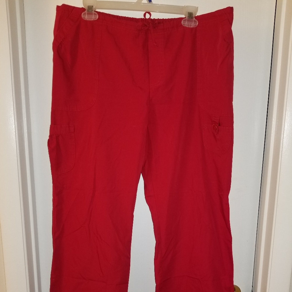 White cross red scrub pants